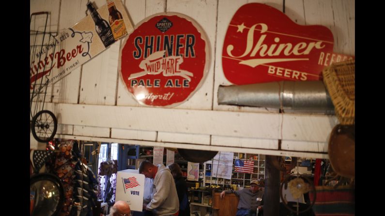 Voters cast their ballots at a polling station in the Rabbit Hash General Store in Rabbit Hash, Kentucky. 