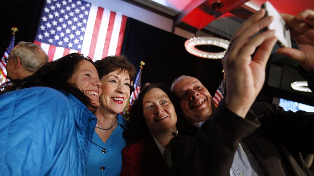 U.S. Sen. Susan Collins poses for a selfie with supporters while celebrating her re-election victory in Portland, Maine. 