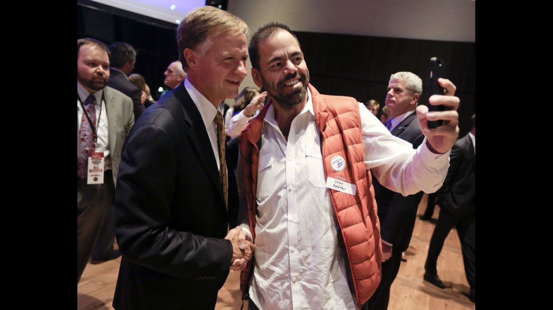 Tennessee Gov. Bill Haslam poses for a photo with supporter Steve Griffin, right, after Haslam was re-elected. 