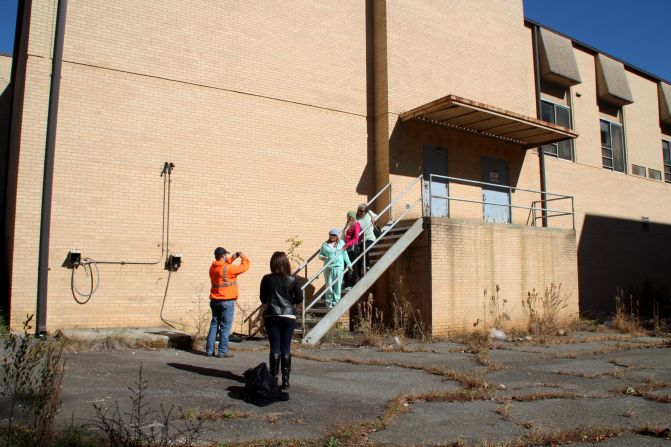 The building is actually part of the Atlanta Mission offices on Bolton Road on the westside of Atlanta. During a recent "Big Zombie" tour, three fans from Tennessee posed for a snapshot on the steps that Rick took out of the hospital.