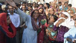 Relatives mourn the death of a Pakistani Christian couple in Kot Radha Kishan, some 60 kilometres (40 miles) southwest of Lahore on November 5, 2014. An enraged Muslim mob beat a Christian couple to death in Pakistan and burnt their bodies in the brick kiln where they worked on November 4 for allegedly desecrating a Koran, police said.  AFP PHOTO/Arif ALI        (Photo credit should read)