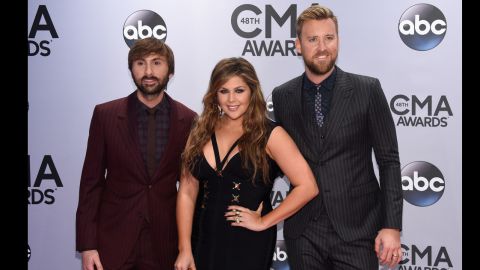 Dave Haywood, Hillary Scott, and Charles Kelley of Lady Antebellum attend the 48th annual CMA Awards at the Bridgestone Arena on Wednesday, November 5, in Nashville, Tennessee. 