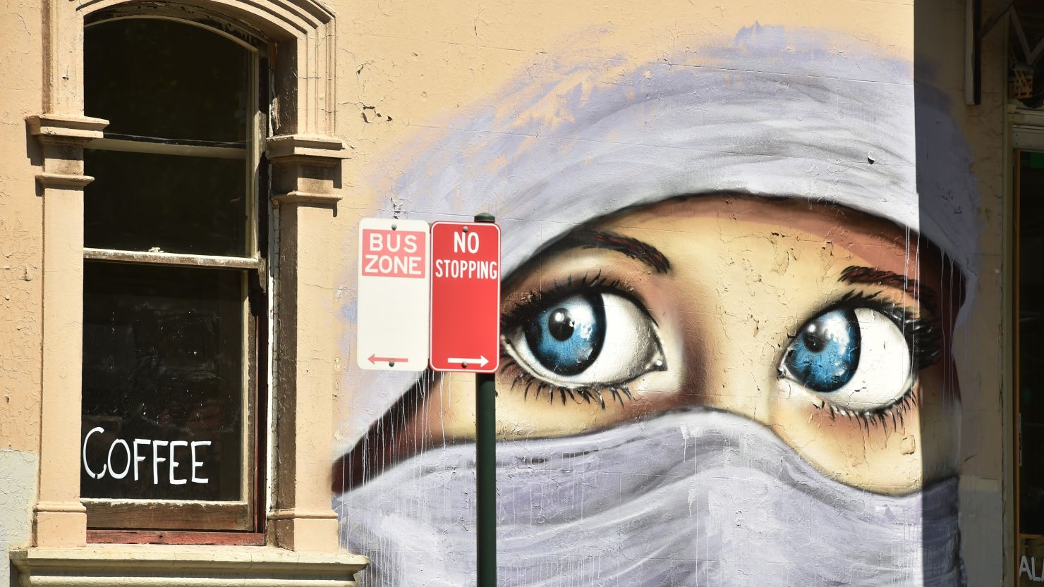 A mural of a Muslim woman in Sydney, where a Shia leader was shot by suspected Sunni extremists Monday.