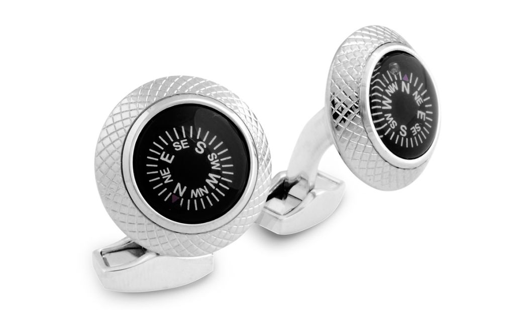 Even tented camps on luxury safaris have black tie dinners. Tateossian round compass cufflinks add a safari-inspired touch to a swanky meal.