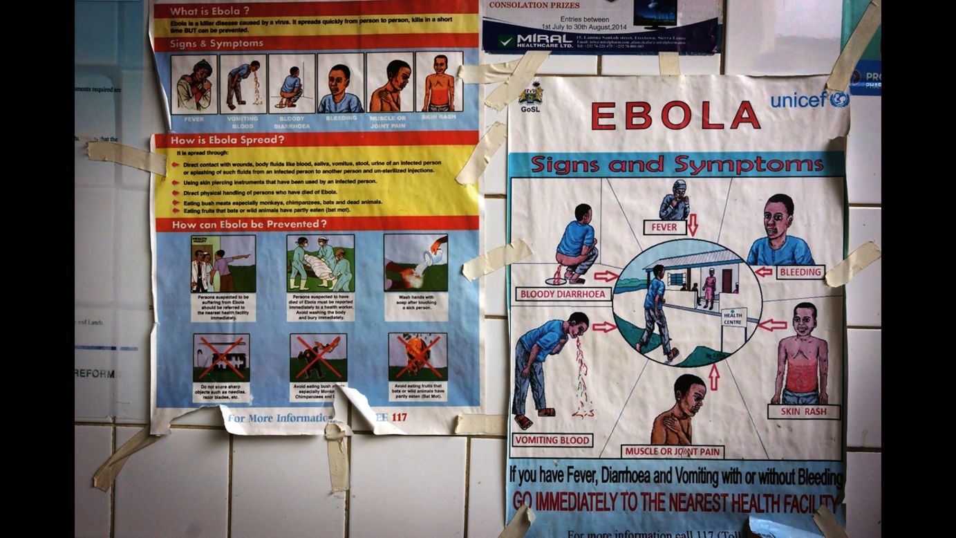 Posters warn and explain the symptoms ebola. (Luigi Baldelli/ECHO)