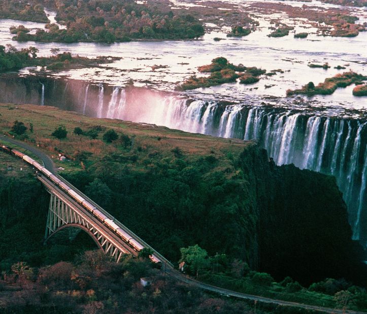 Crossing the Zambezi River on its landmark bridge is like living on a movie set, the mist of Victoria Falls thundering upward on one side, the dark rocks of the gorge plunging down on the other.