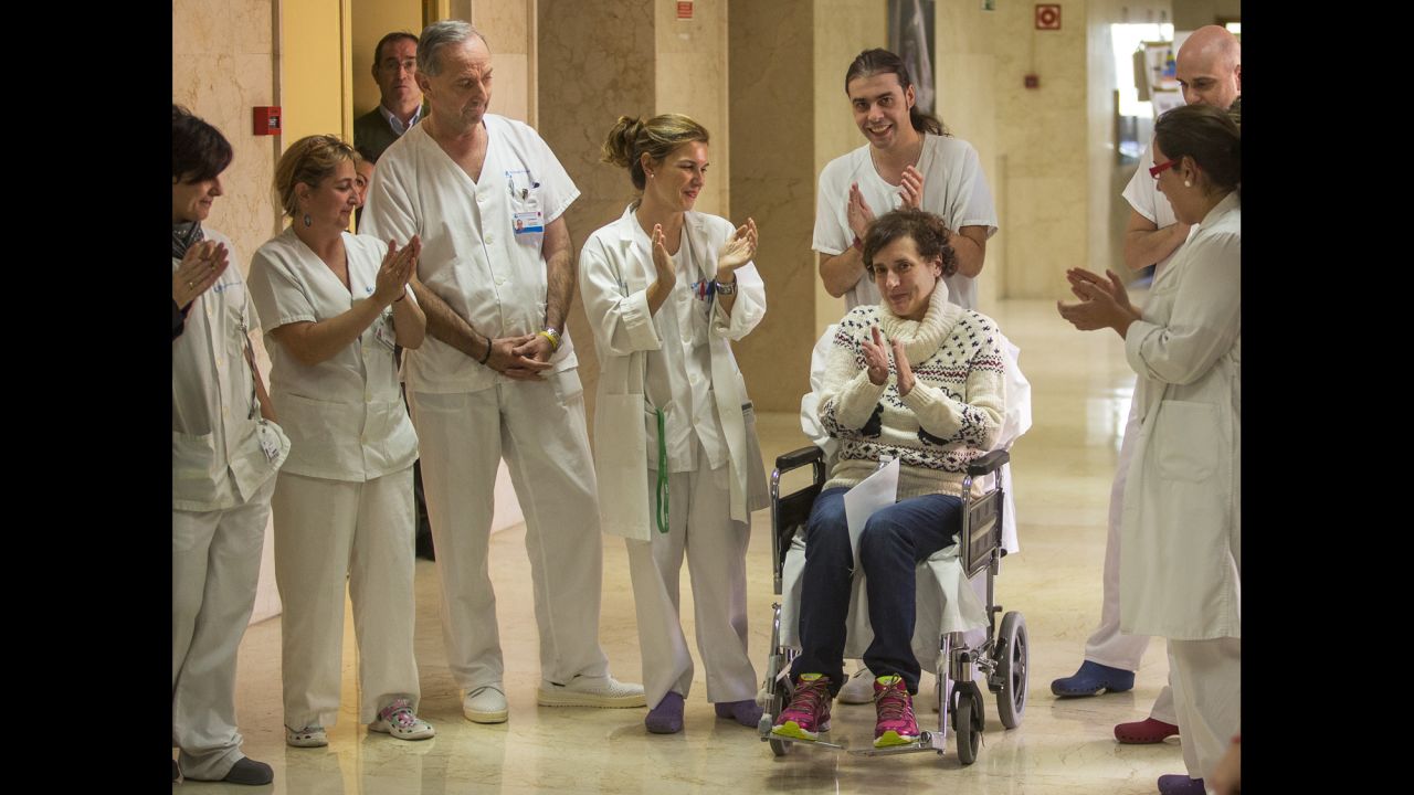 Teresa Romero, sitting in a wheelchair, celebrates with medical workers in the Carlos III Hospital in Madrid on Wednesday, November 5. Romero, a Spanish nursing assistant, was discharged from the hospital a month after she was admitted with the Ebola virus. She was the first person known to have contracted the disease outside of West Africa in the latest outbreak.