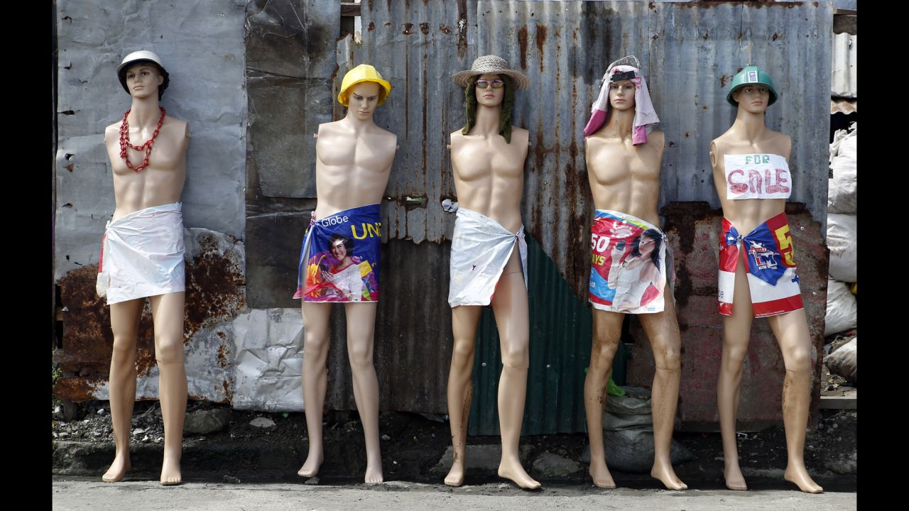 Mannequins for sale are displayed along a road in Tacloban in the Philippines on Wednesday, November 5. A resident said the mannequins were recovered among debris after Typhoon Haiyan a year ago.