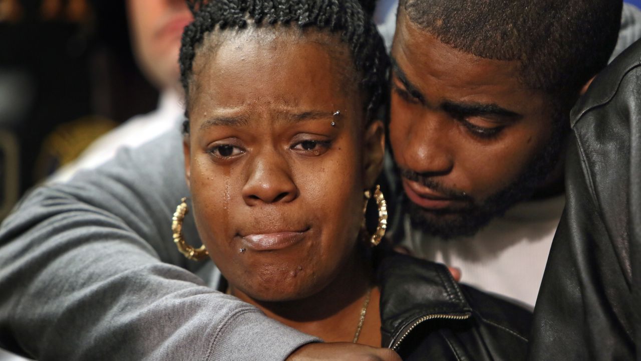 Keisha Gaither, mother of kidnapping victim Carlesha Freeland-Gaither, is comforted during a news conference in Philadelphia on Tuesday, November 4.  Freeland-Gaither was found alive in Maryland three days after her abduction was captured on a surveillance video in Philadelphia, sparking an all-out manhunt.