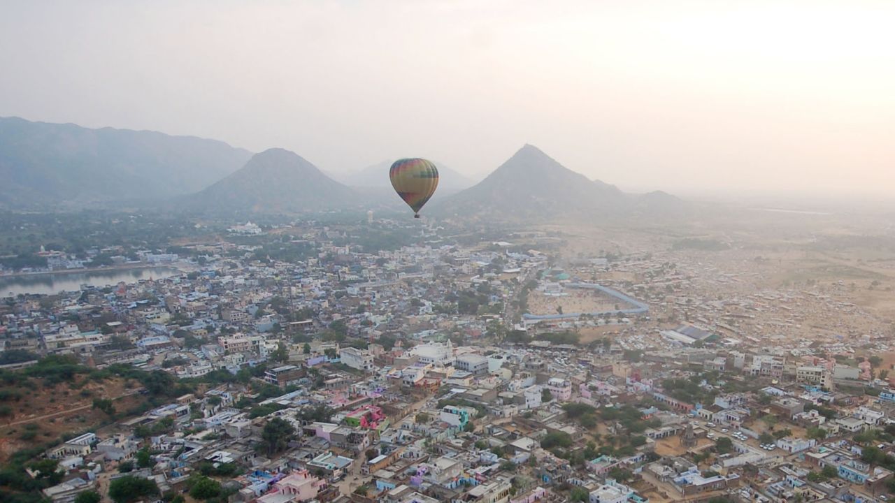 A hot air balloon flies over the International Pushkar Fair on Monday, November 3, in Pushkar, India. The weeklong event is the largest cattle exhibition and trading fair in the country.