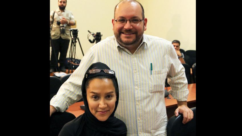 A file picture shows Iranian-American Washington Post correspondent Jason Rezaian and his Iranian wife Yeganeh Salehi posing while covering a press conference at Iran's Foreign Ministry in Tehran, on September 10, 2013. Tehran's chief justice Gholamhossein Esmaili confirmed the arrest of Washington Post correspondent Jason Rezaian and his wife, also a journalist, the official IRNA news agency reported. Rezaian, 38, has been the Post correspondent in Tehran since 2012 and holds both American and Iranian citizenship, according to the newspaper and his wife is an Iranian who has applied for US permanent residency and works as a correspondent for The Nation newspaper based in the United Arab Emirates, the Post said. AFP PHOTO/STRSTR/AFP/Getty Images