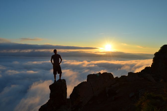 <a href="http://ireport.cnn.com/docs/DOC-1015010">Laneda Rose Smith </a>photographed this stunning image of her friend, Patrick, standing on Flattop Mountain in Anchorage, Alaska, at sunset. "Being above the clouds while not in an airplane was one of the most remarkable things I have ever witnessed."