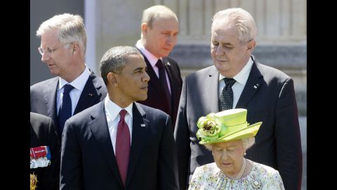 Putin walks behind Obama and Queen Elizabeth during a group photo of world leaders attending the D-Day 70th anniversary ceremonies in June 2014 in Benouville, France.