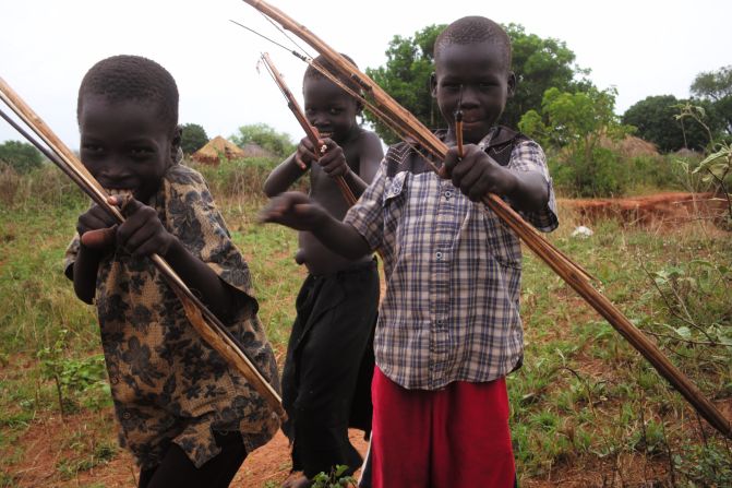 In Uganda, he met a troop of boys who were hunting bush rat with bows and arrows.