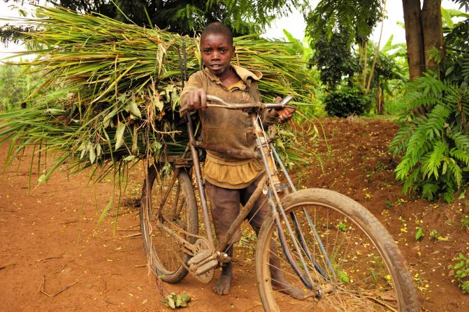 While traveling through Rwanda's wetlands, Wood encountered many of the local children harvesting crops -- the de facto activity when school's not in session.