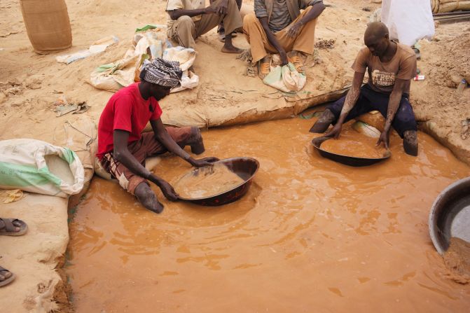 Wood visited Sudan's Al-Abidiya, known for gold. There, locals shifted through tubs of mercury and ore in the hope of striking it rich.