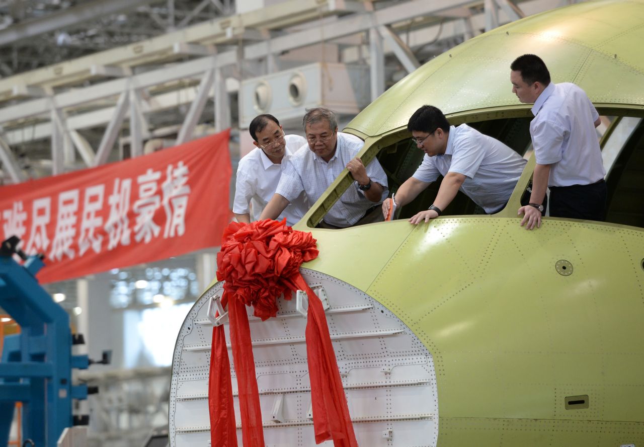 A new C919 airliner is celebrated on July 31 in Chengdu, China. The 168-seat C919, being built by the Shanghai-based Commercial Aircraft Corporation of China, is supposed to someday be the nucleus of a fleet of Chinese-built passenger aircraft.