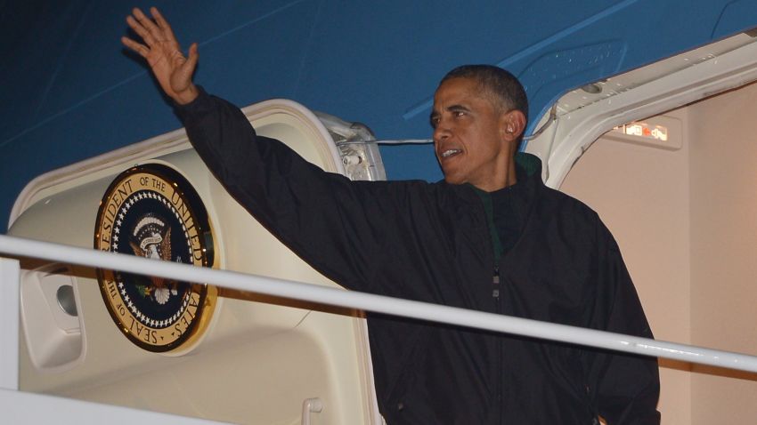 President Barack Obama waves as he boards Air Force One, Sunday, Nov. 9, 2014, at Andrews Air Force Base, Md. Obama is traveling to the Asia-Pacific region for a week of international summits. MANDEL NGAN/AFP/Getty Images)