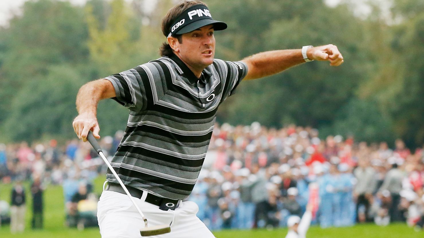 Bubba Watson produced two moments of magic on the 18th green to win the WGC-HSBC tournament in Shanghai.