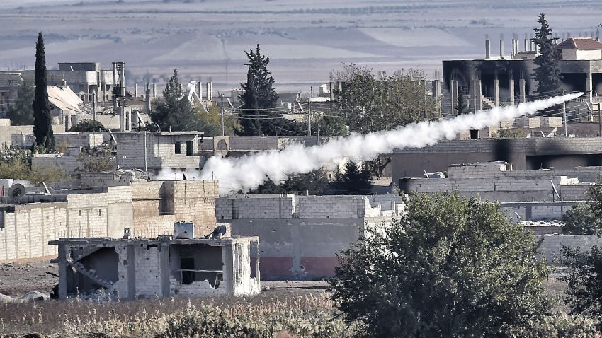 Islamic State militants fire rockets at Kurdish People's Protection Units positions Kobani, Syria, on Saturday.