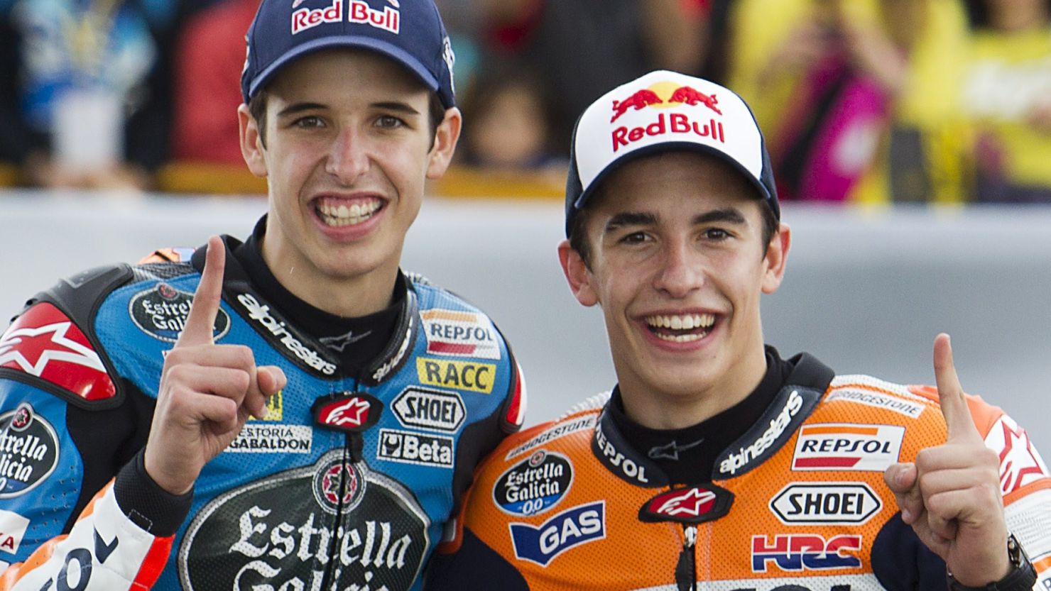 Alex and Marc Marquez (right) celebrate their double triumph in the final round of the MotoGP season in Valencia.