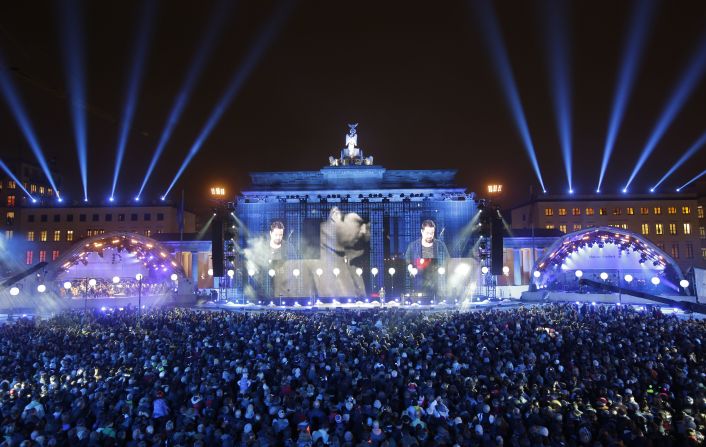 Thousands of people gather in front of Brandenburg Gate  on Sunday, November 9, during the central event commemorating the fall of the Berlin Wall. Twenty-five years ago, on November 9, 1989, the East German government lifted travel restrictions between East and West Germany. 