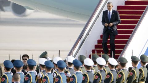 U.S. President Barack Obama steps off Air Force One as he arrives to attend the Asia-Pacific Economic Cooperation (APEC) Summit in Beijing, Monday, Nov. 10, 2014.