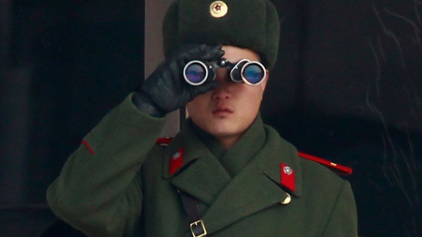 File photo: A N. Korean soldier looks at S. Korea across the Korean Military Demarcation Line (MDL) separating South and North Korea, on December 28, 2011 in Panmunjom, S. Korea.
