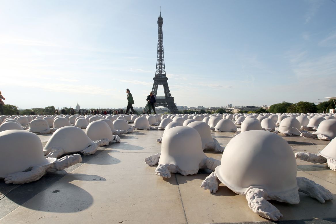<strong><em>Peace Turtles by Rachid Khimoune, Paris, 2011 </em></strong><br /><br />Artist Rachid Khimoune set up 1000 turtles made from casts of German, Russian and American helmets in front of important French sites, most recently at Trocadero gardens near the Eiffel Tower in 2011. By having the turtle, which Khimoune considers a symbol of wisdom and humanity, wear a war helmet as its shell, Khimoune aims to express the senseless inhumanity of global conflict.