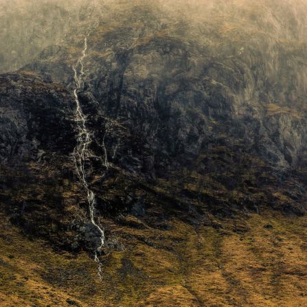 This year's overall winner, titled "A Beginning and an End," is an intensely detailed shot of a mountainside in Glencoe, Scotland.<br /><br />Mark Littlejohn's image of ragged cliffs marbled by gushing streams covers such a narrow color palette that it almost resembles an impressionistic painting. 