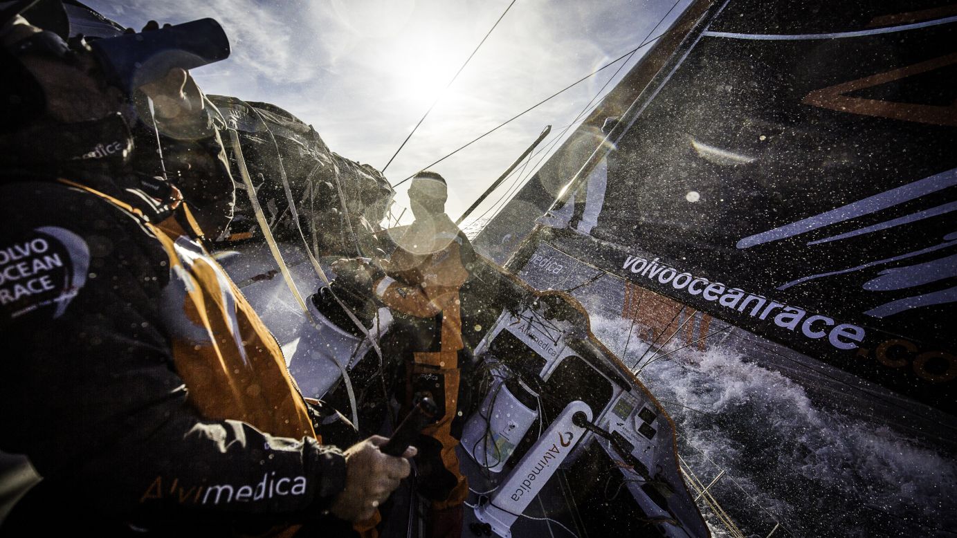 Ryan Houston of Team Alvimedica, left, gets the day started with some coffee on Wednesday, November 5, during the first leg of the Volvo Ocean Race between Alicante, Spain, and Cape Town, South Africa. The route spans some 39,379 nautical miles and visits 11 ports in 11 countries.