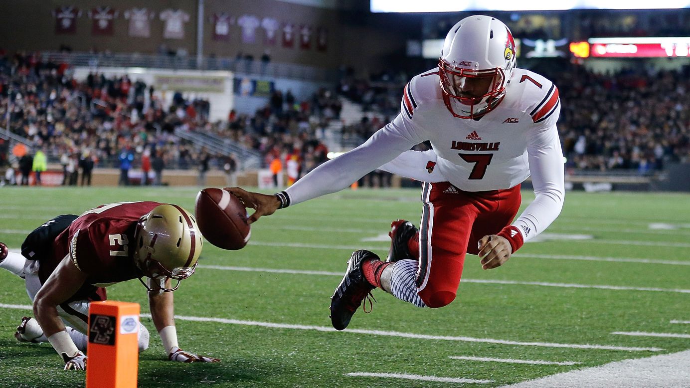 Reggie Bonnafon of the Louisville Cardinals comes up short of the end zone as Justin Simmons of the Boston College Eagles defends in the second quarter at Alumni Stadium in Chestnut Hill, Massachusetts, on Saturday, November 8. The Cardinals won 38-19.