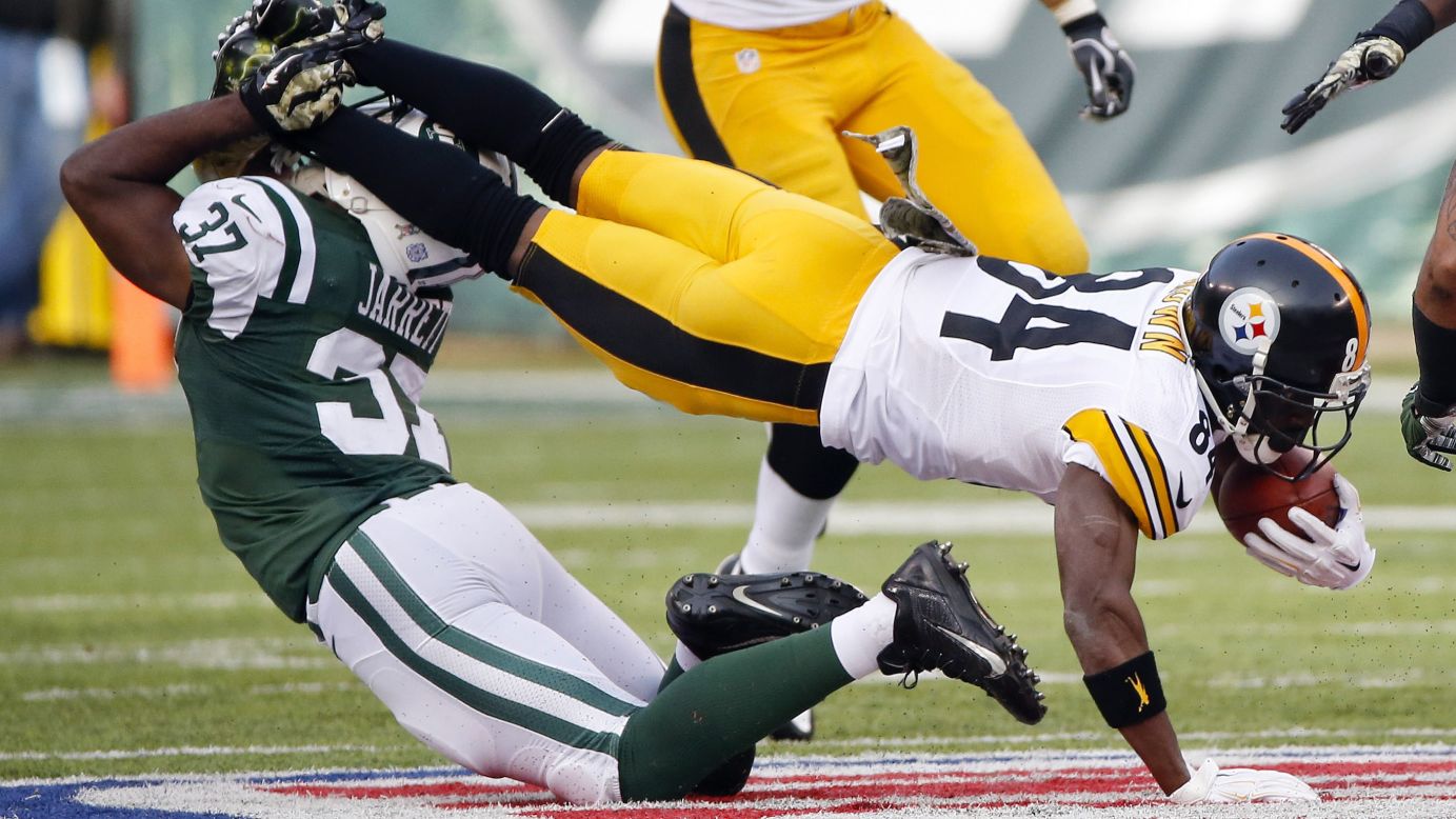 New York Jets free safety Jaiquawn Jarrett tackles Pittsburgh Steelers' Antonio Brown in the first half on Sunday, November 9, at MetLife Stadium in East Rutherford, New Jersey.