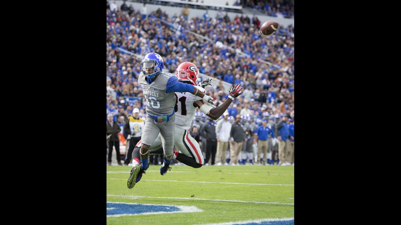 Kentucky cornerback Cody Quinn, left, breaks up a pass intended for Georgia wide receiver Chris Conley at Commonwealth Stadium in Lexington, Kentucky, on Saturday, November 8. The Georgia Bulldogs beat the Kentucky Wildcats 63-31.