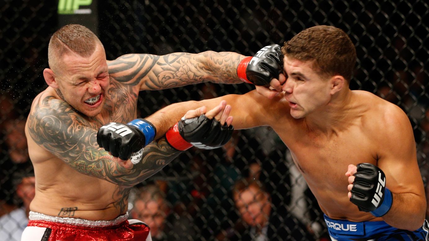 Ross Pearson, left, of England and Al Iaquinta of the United States trade punches in their lightweight bout during the UFC Fight Night event on Saturday, November 8, at Allphones Arena in Sydney, Australia. Iaquinta won in the second round.