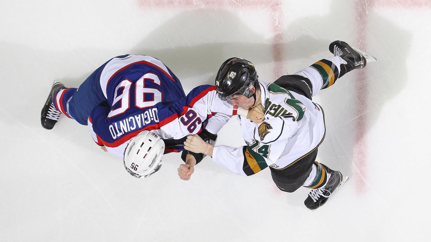 Christiano DiGiacinto of the Windsor Spitfires dukes it out with Aiden Jamieson of the London Knights in an Ontario Hockey League game at Budweiser Gardens in London, Ontario, on Friday, November 7. The Knights defeated the Spitfires 5-3.