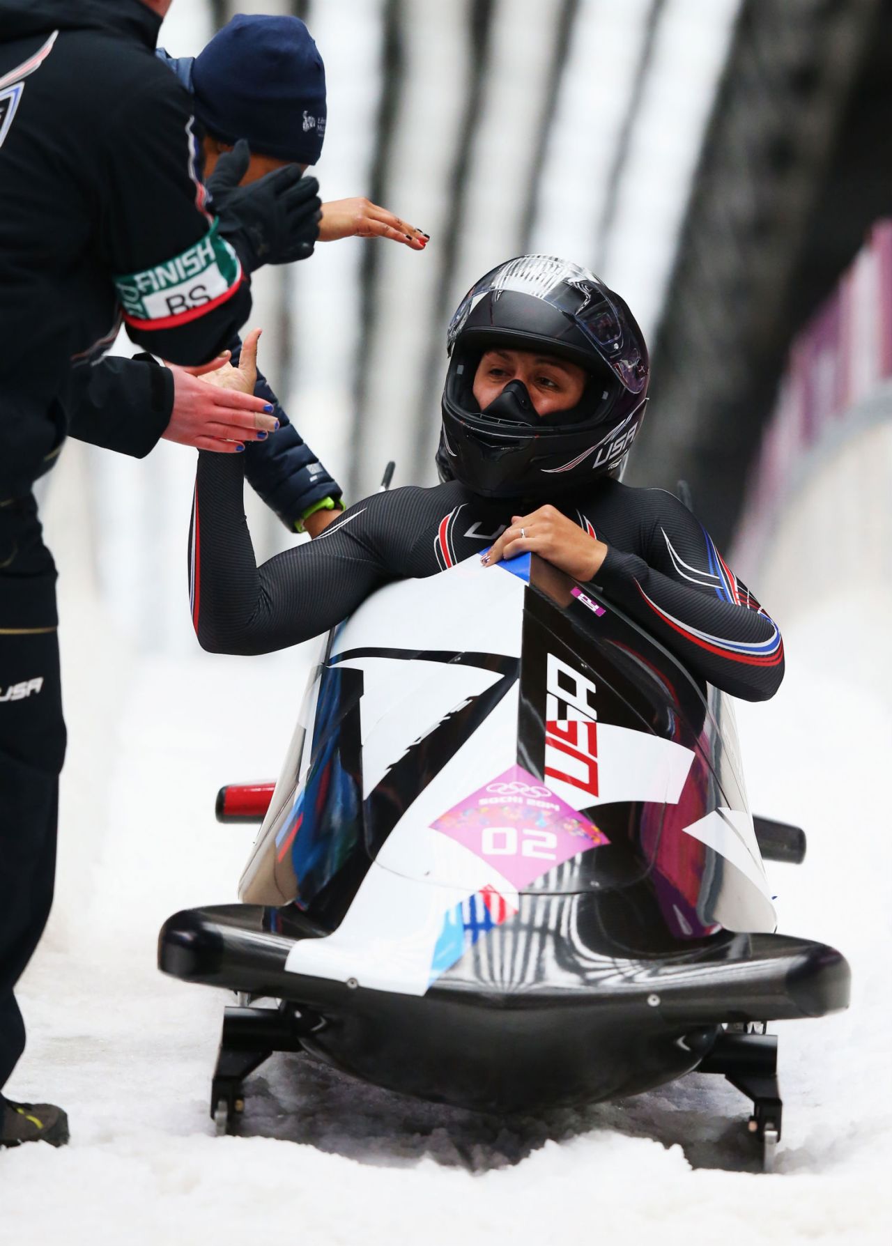 Elana Meyers Taylor -- now coached in part by her husband, in Arizona -- has become one of the "fastest and strongest" pilots in the world of women's bobsled.