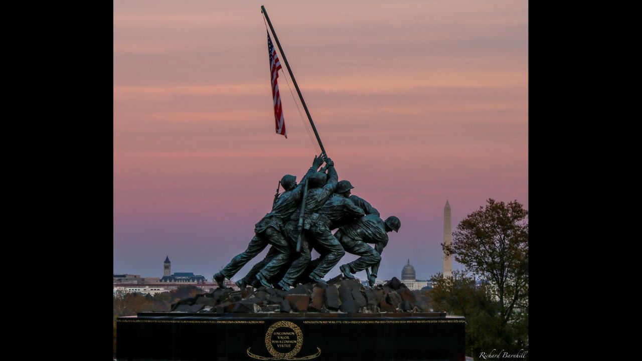 As the sun set around Washington, D.C., <a href="http://ireport.cnn.com/docs/DOC-1187523">Richard Barnhill </a>caught this shot of the Marine Corps War Memorial against the pink fall sky. The<a href="http://www.nps.gov/gwmp/historyculture/usmcwarmemorial.htm" target="_blank" target="_blank"> Marine Corps War Memorial</a> inscription reads: "In honor and in memory of the men of the United States Marine Corps who have given their lives to their country since November 10, 1775."