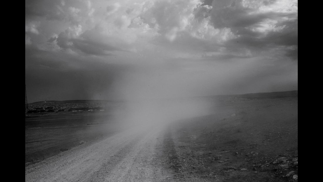 Dust rises from the road on the Syrian border.