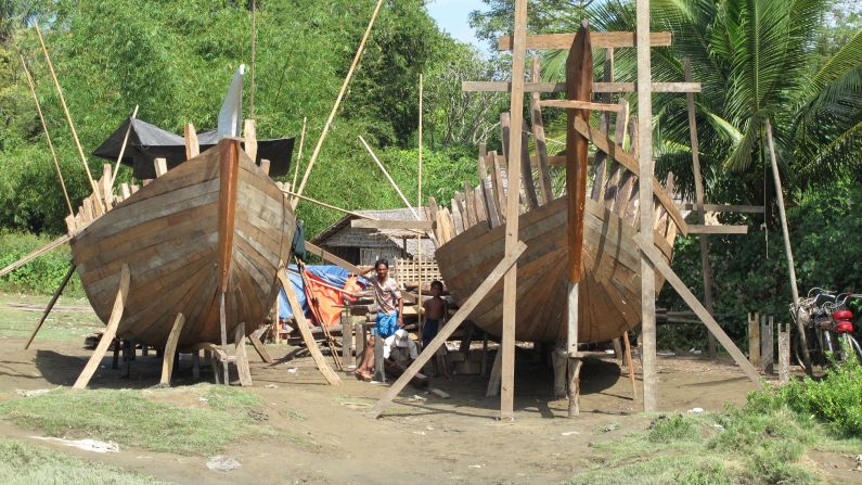 Rohingya fishermen build boats. They say human traffickers use boats like these to illegally transport Rohingya to other countries in search of a better life. Many risk everything to leave Myanmar. Boats this size can carry 50 to 60 people, the builders say.
