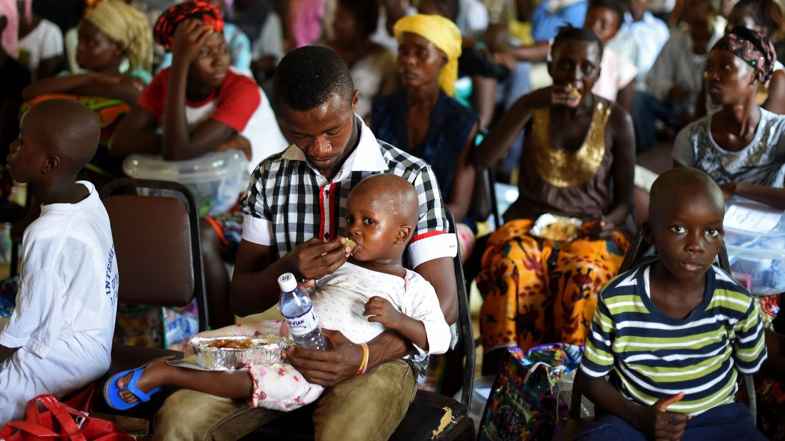 A child who survived the Ebola virus is fed by another survivor at a treatment center in Hastings, Sierra Leone, in November. The Ebola outbreak started with an infected toddler in a remote village in December 2013, but it wasn't until April 2014 that WHO leaders conceded the epidemic was a "concern." They didn't declare it a Public Health Emergency of International Concern until August. They <a href="http://www.unmultimedia.org/tv/unifeed/2014/04/geneva-ebola-2/" target="_blank" target="_blank">initially contradicted</a> international aid organizations that had labeled the epidemic "unprecedented." In January, the nonprofit Oxfam called for a <a href="https://www.oxfam.org/en/pressroom/pressreleases/2015-01-26/oxfam-calls-massive-post-ebola-marshall-plan" target="_blank" target="_blank">Marshall-type of plan</a> to put the three West African countries hit by the crisis back on their feet. The agency said that the world "cannot dither" on putting the countries' economies on an inclusive growth plan.