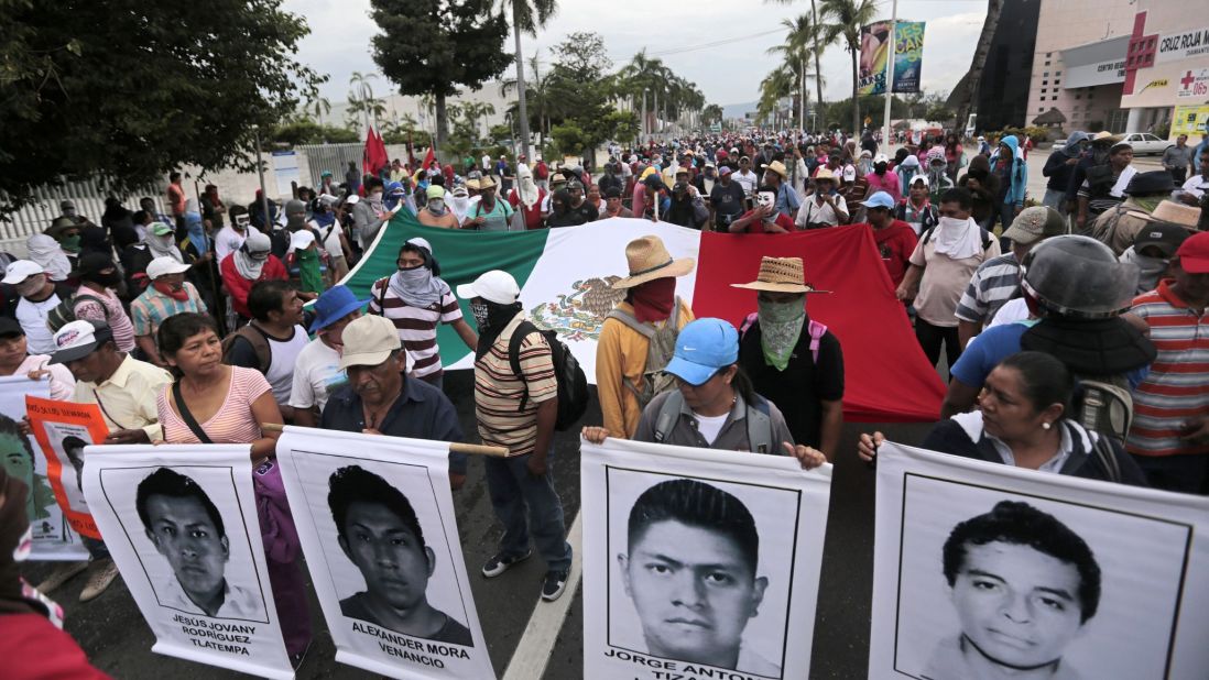 Protesters march in Acapulco on November 10. 