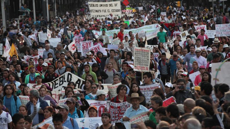 Tens of thousands of demonstrators march in Mexico City on Wednesday, November 5, demanding that the missing students be found alive.