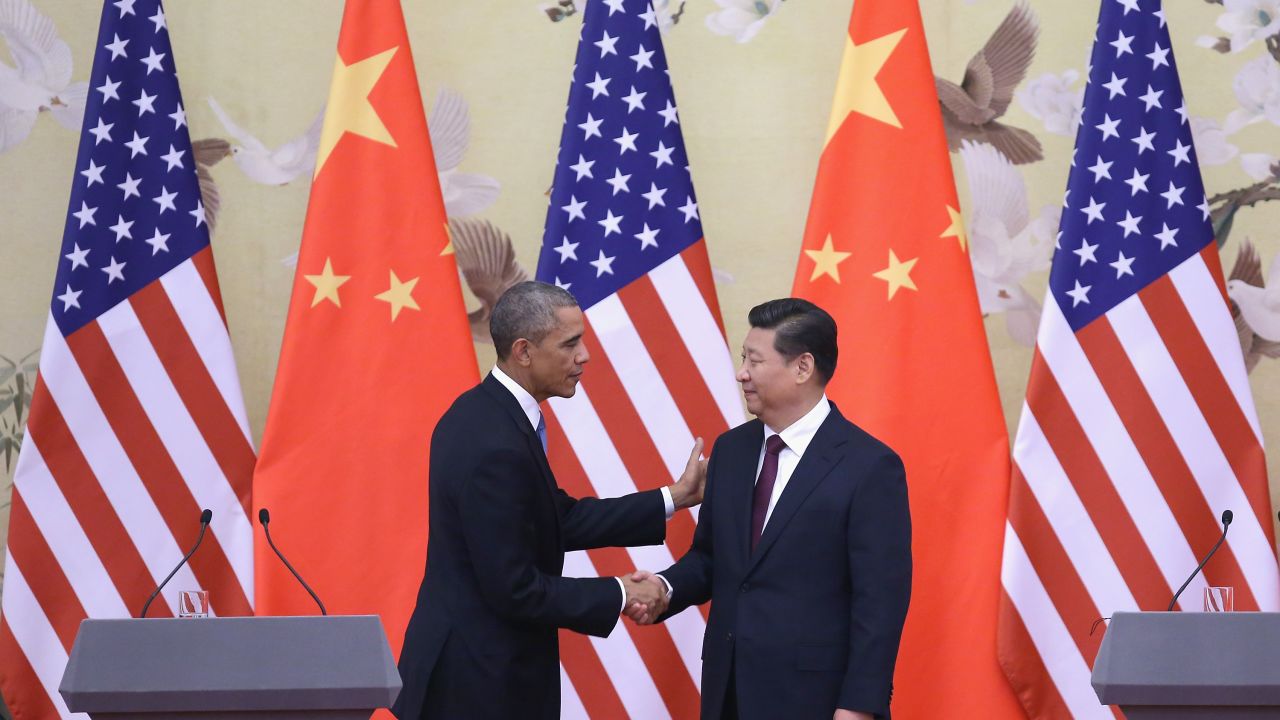 President Barack Obama (L) shakes hands with President Xi Jinping (R) in Beijing last year.