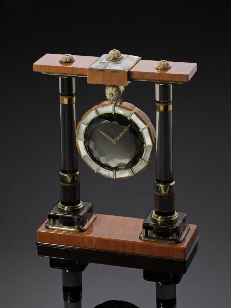 A Cartier Mystery Clock made of silver gilt, diamond, mother-of-pearl, smoky quartz and coral sold for $215,711.