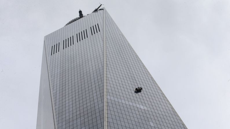 Officials said New York Police Department emergency services units were on the scene and rescue workers had been able to communicate with the two window washers.