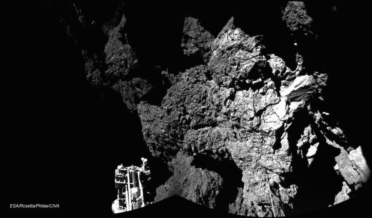 The Rosetta spacecraft's Philae lander is shown sitting on Comet 67P/Churyumov-Gerasimenko after becoming the first space probe to land on a comet on November 12, 2014. The probe's harpoons failed to fire, and Philae bounced a few times. The lander was able to send back images and data for 57 hours before losing power.