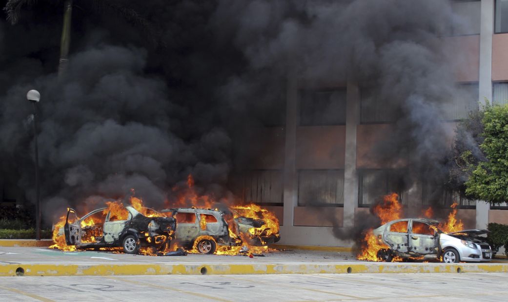 Cars burn in front of the state Congress building in Chilpancingo on Wednesday, November 12. <a href="http://www.cnn.com/2014/11/04/world/americas/mexico-missing-students/index.html">Authorities have arrested Iguala Mayor Jose Luis Abarca</a>, called the "probable mastermind" in the mass abduction, and his wife, Maria de los Angeles Pineda.