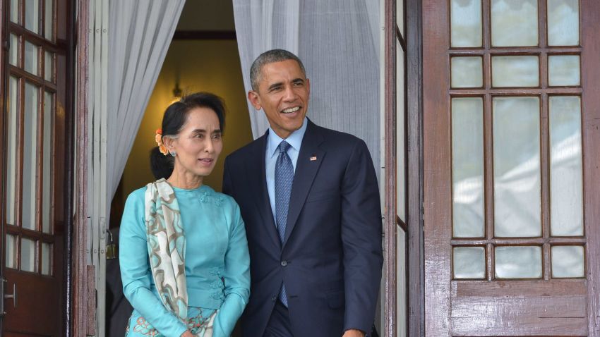 U.S. President Barack Obama and Myanmar's opposition leader Aung San Suu Kyi arrive for a press conference at her residence in Yangon on November 14, 2014.