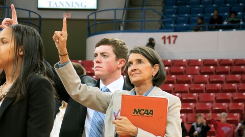 Tyler Summitt stands with his assistant Mickie DeMoss, who also served as his mother's assistant coach for 18 seasons. "I've been around a lot of coaches, and he ranks right up there in my book," she says. 